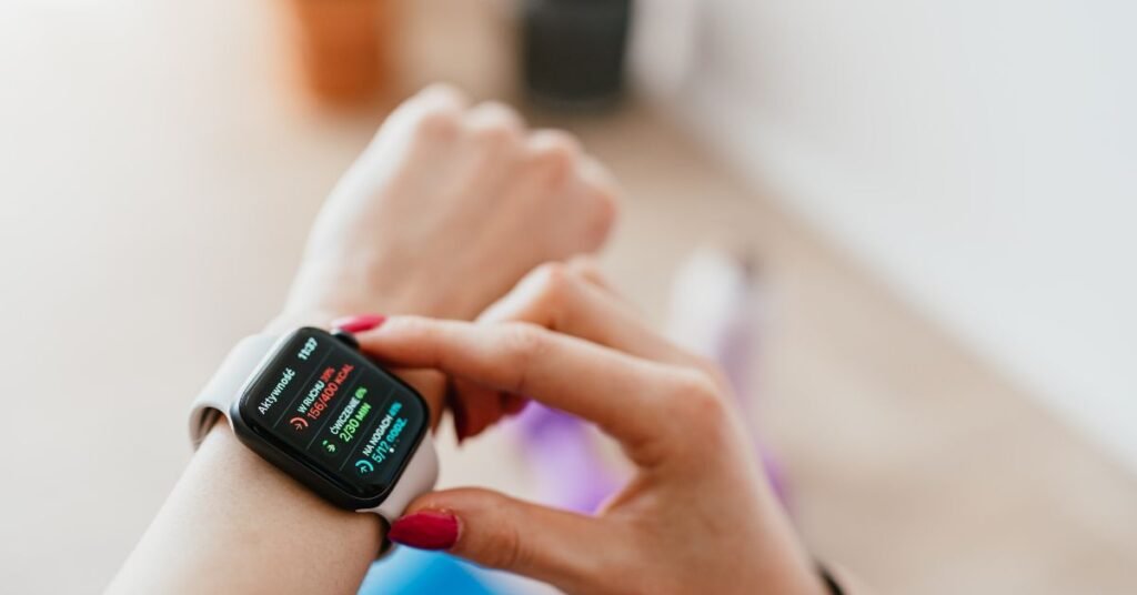 Close-up of smartwatch showing heart rate and health tracking data