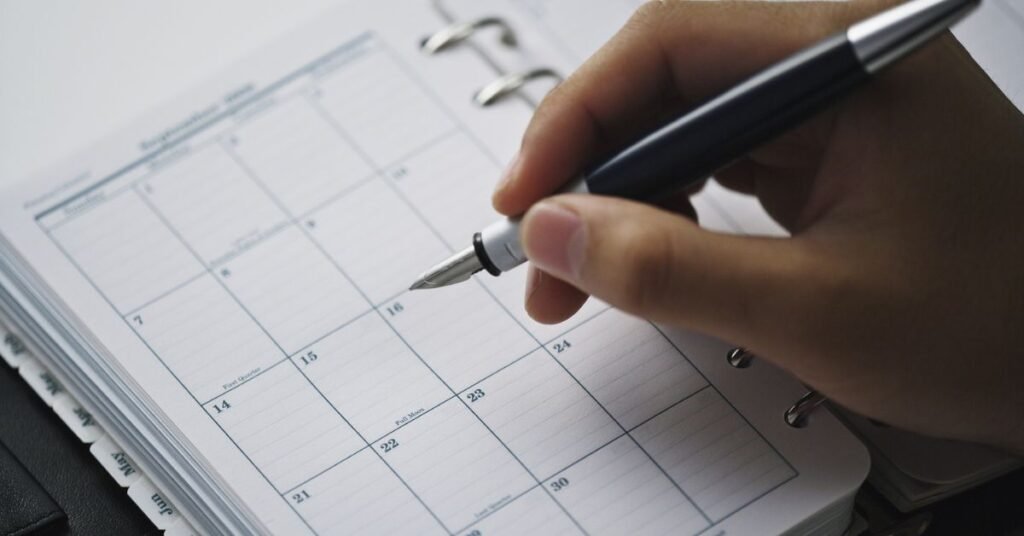 Person planning a weekly routine for irregular schedule using a calendar